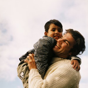 Young Father Holding His Young Son (4-6)